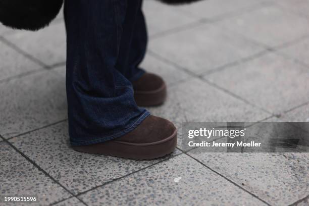 Anna Winter seen wearing Gant dark brown fake fur long coat, Closed dark blue denim oversized belted baggy jeans / pants and UGG ultra mini brown...