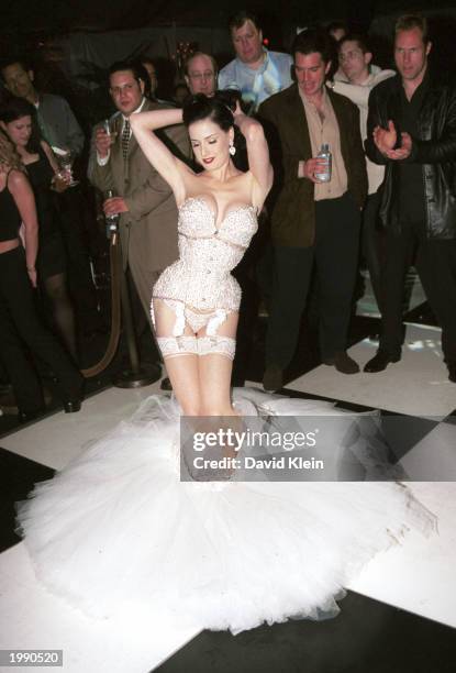 Burlesque performer Dita Von Teese prepares for her martini dance during the Dewar's 12 Playboy Lounge Tour, featuring Von Teese, Playmate of the...