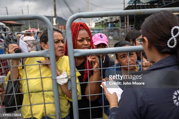 Family members of people taken into custody speak to a government official outside a prison on February 05, 2024 near Guayaquil, Ecuador. Thousands...