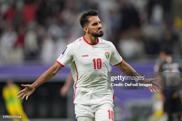 Mousa Tamari of Jordan celebrate after scoring his team's second goal during the AFC Asian Cup semi final match between Jordan and South Korea at...