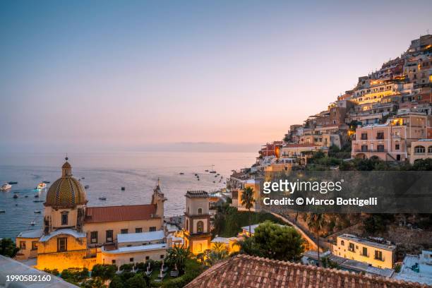 positano at dusk, amalfi coast, italy - cupola stock pictures, royalty-free photos & images