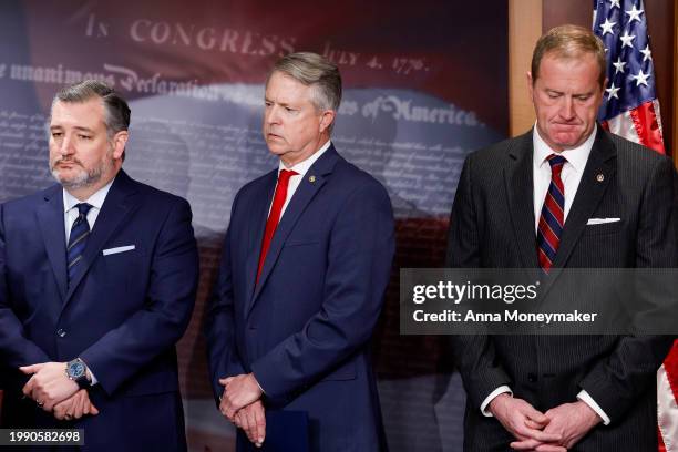 Sen. Ted Cruz , Sen. Roger Marshall and Sen. Eric Schmitt listen as Sen. Rick Scott speaks during a news conference on the U.S. Southern Border at...