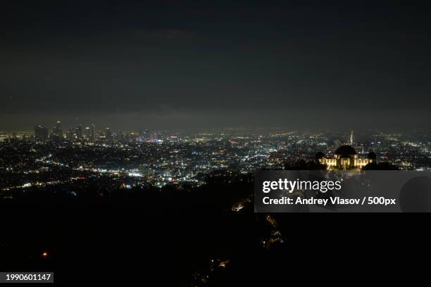 high angle view of illuminated buildings against sky at night,glendale,california,united states,usa - glendale california stock pictures, royalty-free photos & images