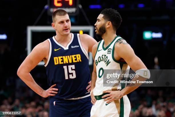 Nikola Jokic of the Denver Nuggets talks with Jayson Tatum of the Boston Celtics during the second quarter at TD Garden on January 19, 2024 in...