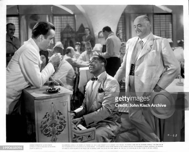 Publicity portrait of, from left, Humphrey Bogart , Dooley Wilson , and Sidney Greenstreet in the film 'Casablanca' , 1942.