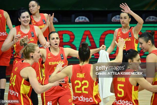 Spanish players celebrate their victory over Canada after the 2024 FIBA Women's Olympic qualifying tournament basketball match between Canada and...