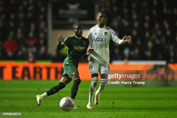 Jaidon Anthony of Leeds United is challenged by Bali Mumba of Plymouth Argyle during the Emirates FA Cup Fourth Round Replay match between Plymouth...