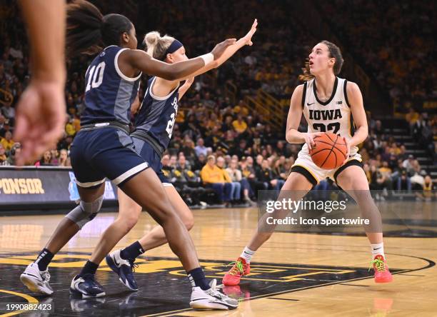 Iowa guard Caitlin Clark sets up a shot during a women's college basketball game between the Penn State Nittany Lions and the Iowa Hawkeyes on...