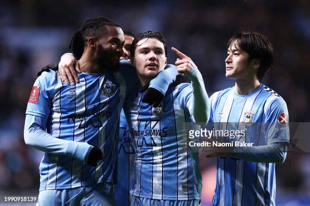 Callum O Hare of Coventry City celebrates scoring his team's second goal with teammates Kasey Palmer and Tatsuhiro Sakamoto during the Emirates FA...