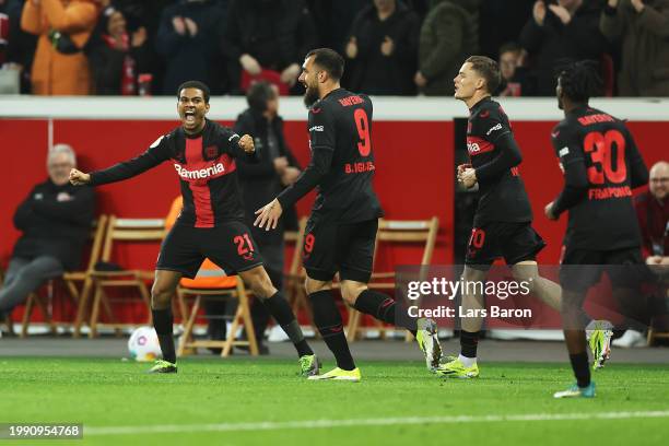 Amine Adli of Bayer Leverkusen celebrates scoring his team's second goal with teammates during the DFB cup quarterfinal match between Bayer 04...