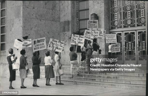 The protest continues - Several housewives marched on City Hall Wednesday carrying signs protesting high water bills in their Sun Valley area homes....