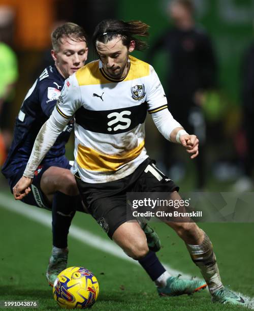 Ethan Chislett of Port Vale attempts to move away from Ethan Galbraith of Leyton Orient during the Sky Bet League One match between Port Vale and...