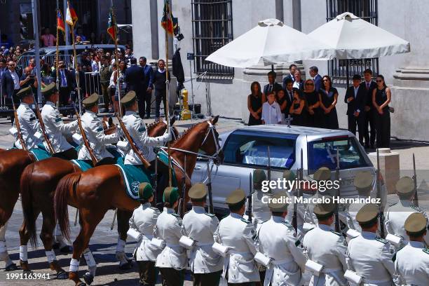 Cecilia Morel alongside her children and grandchildren await the hearse carrying former president Sebastian Piñera at La Moneda palace during the...