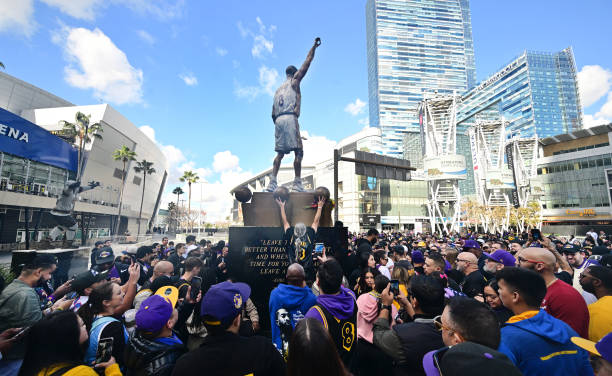 Fans gather around the newly unveiled Kobe Bryant statue outside the Crypto.com Arena on February 9, 2024 in Los Angeles. The 19-foot bronze statue,...