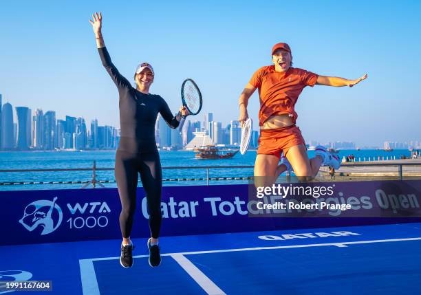 Marketa Vondrousova of the Czech Republic and Iga Swiatek of Poland pose during a photo shoot ahead of the Qatar TotalEnergies Open, part of the...