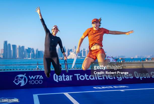 Marketa Vondrousova of the Czech Republic and Iga Swiatek of Poland pose during a photo shoot ahead of the Qatar TotalEnergies Open, part of the...