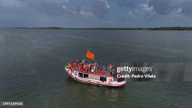 Aerial view of "Cordão Ultima Hora" parading along the Tocantins river during "Carnaval Das Aguas" on February 9, 2024 in Cametá, Brazil. The Water...