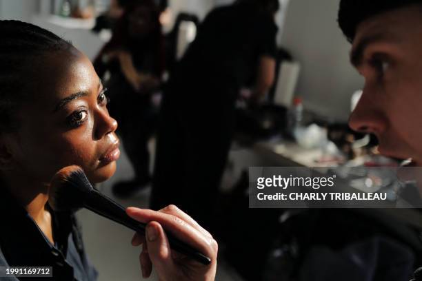 Models get prepared backstage before the presentation of the brand "The Salting" during New York Fashion Week in New York City on February 9, 2024.