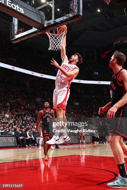 Alperen Sengun of the Houston Rockets dunks the ball during the game against the Toronto Raptors on February 9, 2024 at the Scotiabank Arena in...