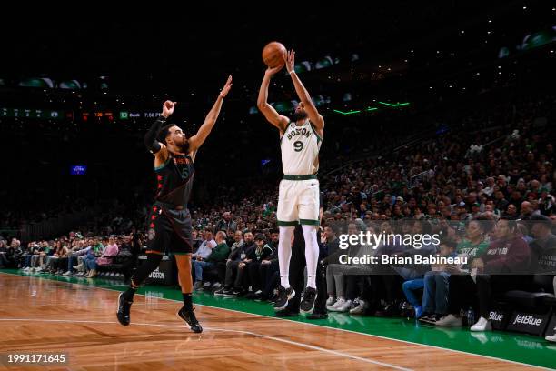 Derrick White of the Boston Celtics shoots a three point basket during the game against the Washington Wizards on February 9, 2024 at the TD Garden...