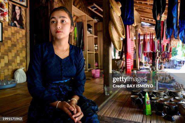 This picture taken on January 25, 2024 shows Rumsah, a member of the Indigenous Baduy tribe, in Kanekes Village in Lebak, Banten province. In the...