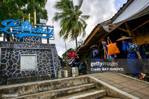 This picture taken on January 25, 2024 shows members of the Indigenous Baduy tribe returning from their fields in Kanekes Village in Lebak, Banten...