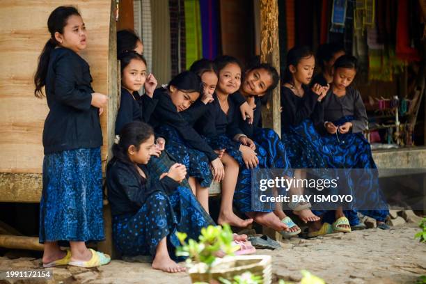 This picture taken on January 25, 2024 shows Indigenous Baduy tribe girls in traditional dress at Kanekes Village, in Lebak, Banten province. In the...