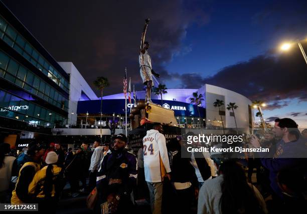 Fans gather in front of newly unveiled statue of late Kobe Bryant before the game between the New Orleans Pelicans and the Los Angeles Lakers at...