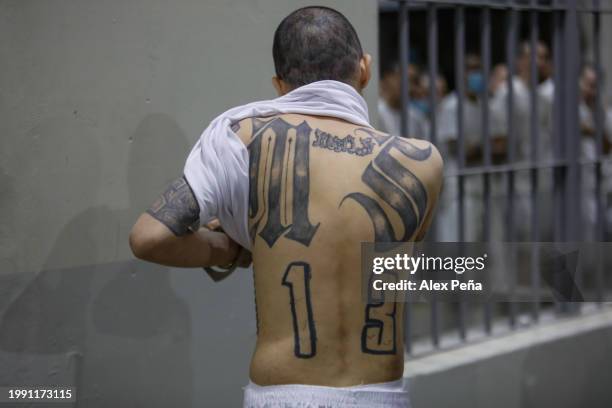 An inmate shows his back tattoos at CECOT in Tecoluca on February 6, 2024 in San Vicente, El Salvador. On February of 2023 El Salvador inaugurated...