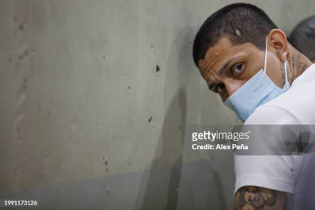 An inmate is seen in cells at CECOT in Tecoluca on February 6, 2024 in San Vicente, El Salvador. On February of 2023 El Salvador inaugurated Latin...
