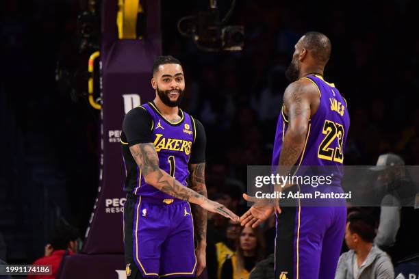 Angelo Russell and LeBron James of the Los Angeles Lakers react during the game against the New Orleans Pelicans on February 9, 2024 at Crypto.Com...