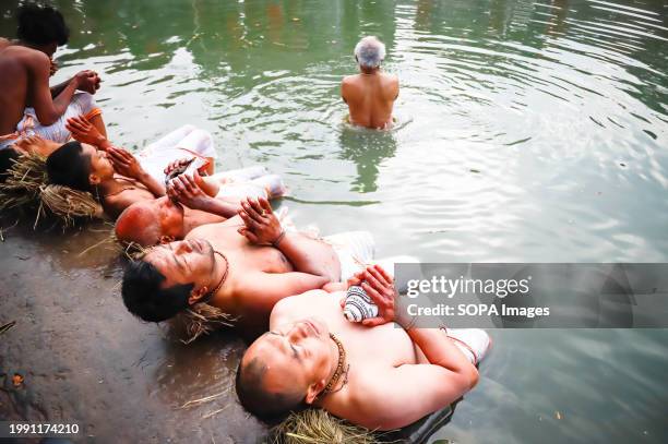 Hindu devotees offer prayers to the Hanuman ghat river during the Swasthani Brata Katha festival in Bhaktapur. The month-long festival, dedicated to...