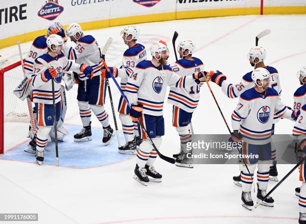 Edmonton Oilers defenseman Mattias Ekholm and his teammates celebrate on the ice after the Oilers defeated the Anaheim Ducks 5 to 3 in an NHL hockey...