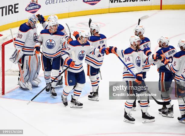 Edmonton Oilers goalie Calvin Pickard , left wing Dylan Holloway , right wing Warren Foegele , defenseman Mattias Ekholm and there teammates...