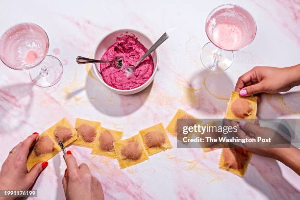 Cranberry Gin Sour Cocktail and Beet and Ricotta Ravioli with Garlic Butter Sauce photographed for Food in Washington, DC on January 29, 2024