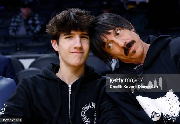 Red Hot Chili Peppers band member Anthony Kiedis and his son Everly Bear Kiedis attend the game between the Los Angeles Lakers and the New Orleans...
