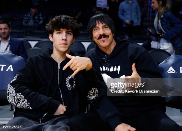 Red Hot Chili Peppers band member Anthony Kiedis and his son Everly Bear Kiedis attend the game between the Los Angeles Lakers and the New Orleans...