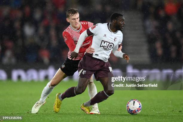 Ken Sema of Watford is challenged by Flynn Downes of Southampton during the Emirates FA Cup Fourth Round Replay match between Southampton and Watford...