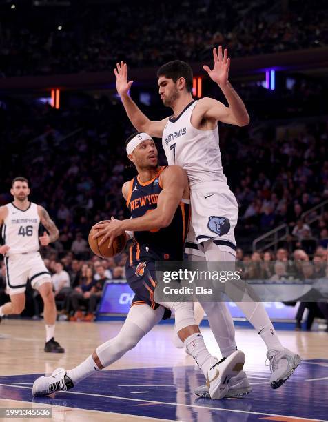 Josh Hart of the New York Knicks heads for the net as Santi Aldama of the Memphis Grizzlies defends in the first half at Madison Square Garden on...