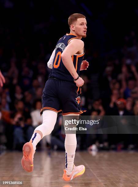 Donte DiVincenzo of the New York Knicks celebrates his three point shot in the first half against the Memphis Grizzlies at Madison Square Garden on...