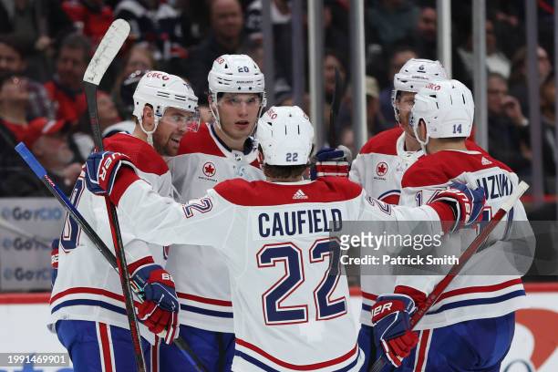 Juraj Slafkovsky of the Montreal Canadiens celebrates his second goal of the game with teammates against the Washington Capitals during the third...