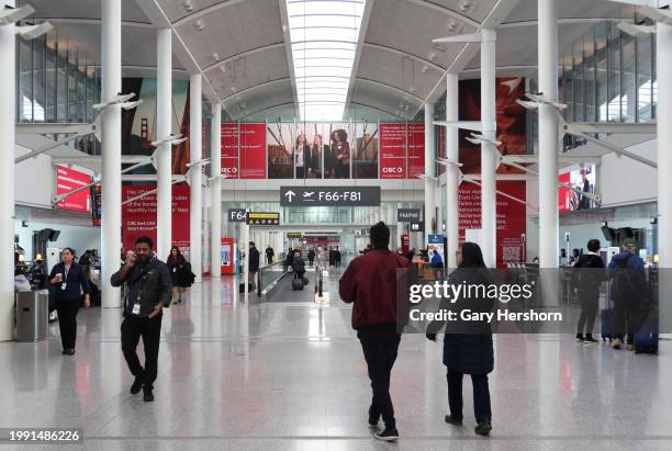 People walk through Terminal 1 at Pearson International Airport on February 6 in Toronto, Canada.