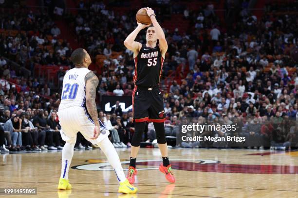 Duncan Robinson of the Miami Heat shoots the ball over Markelle Fultz of the Orlando Magic during the fourth quarter at Kaseya Center on February 06,...