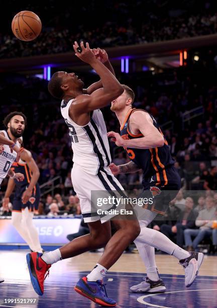 Jackson of the Memphis Grizzlies loses the ball as Isaiah Hartenstein of the New York Knicks defends in the second half at Madison Square Garden on...