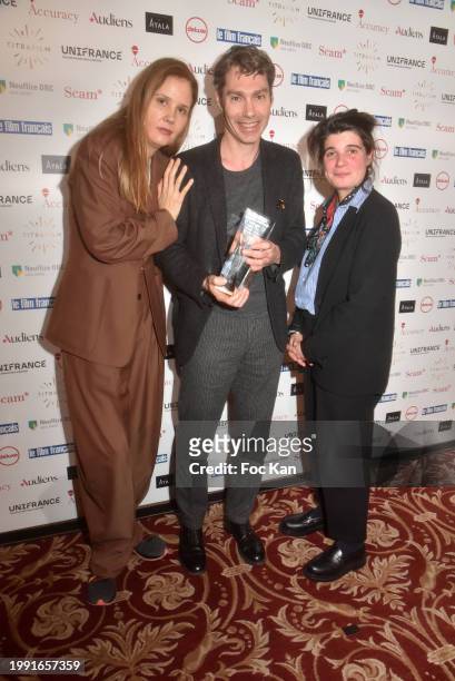 Director Justine Triet, awarded actor David Thion and actress Marie-Ange Luciani attend a photocall for the 31st "Trophees Du Film Francais" at Hotel...