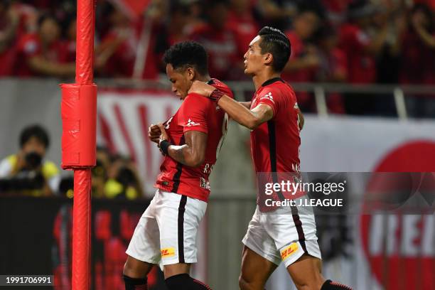 Rafael Silva of Urawa Red Diamonds celebrates with teammate Tomoaki Makino after scoring the team's second goal during the J.League J1 match between...