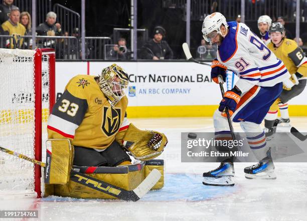 Adin Hill of the Vegas Golden Knights makes a save against Evander Kane of the Edmonton Oilers in the third period of their game at T-Mobile Arena on...