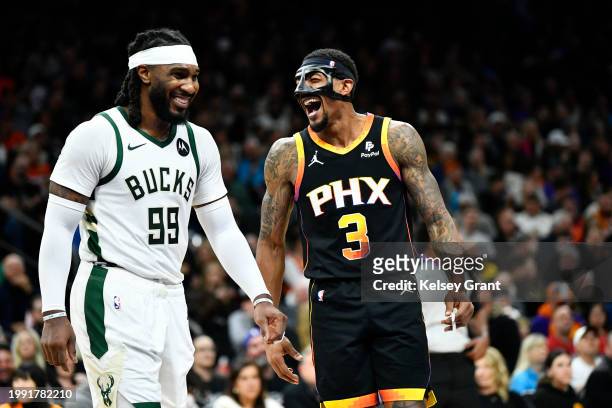 Jae Crowder of the Milwaukee Bucks talks with Bradley Beal of the Phoenix Suns during the first half of the NBA game at Footprint Center on February...