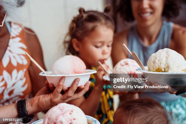 multi-generation family enjoying hawaiian shave ice - snow cones shaved ice stock pictures, royalty-free photos & images