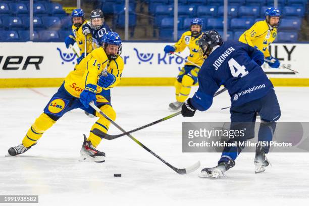 Mans Toresson of Team Sweden tries to block the shot of Mitja Jokinen of Team Finland during U18 Five Nations Tournament between Finland and Sweden...